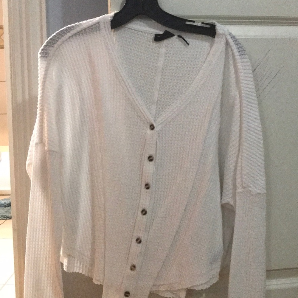 White Out from under Urban Outfitters sweater top.